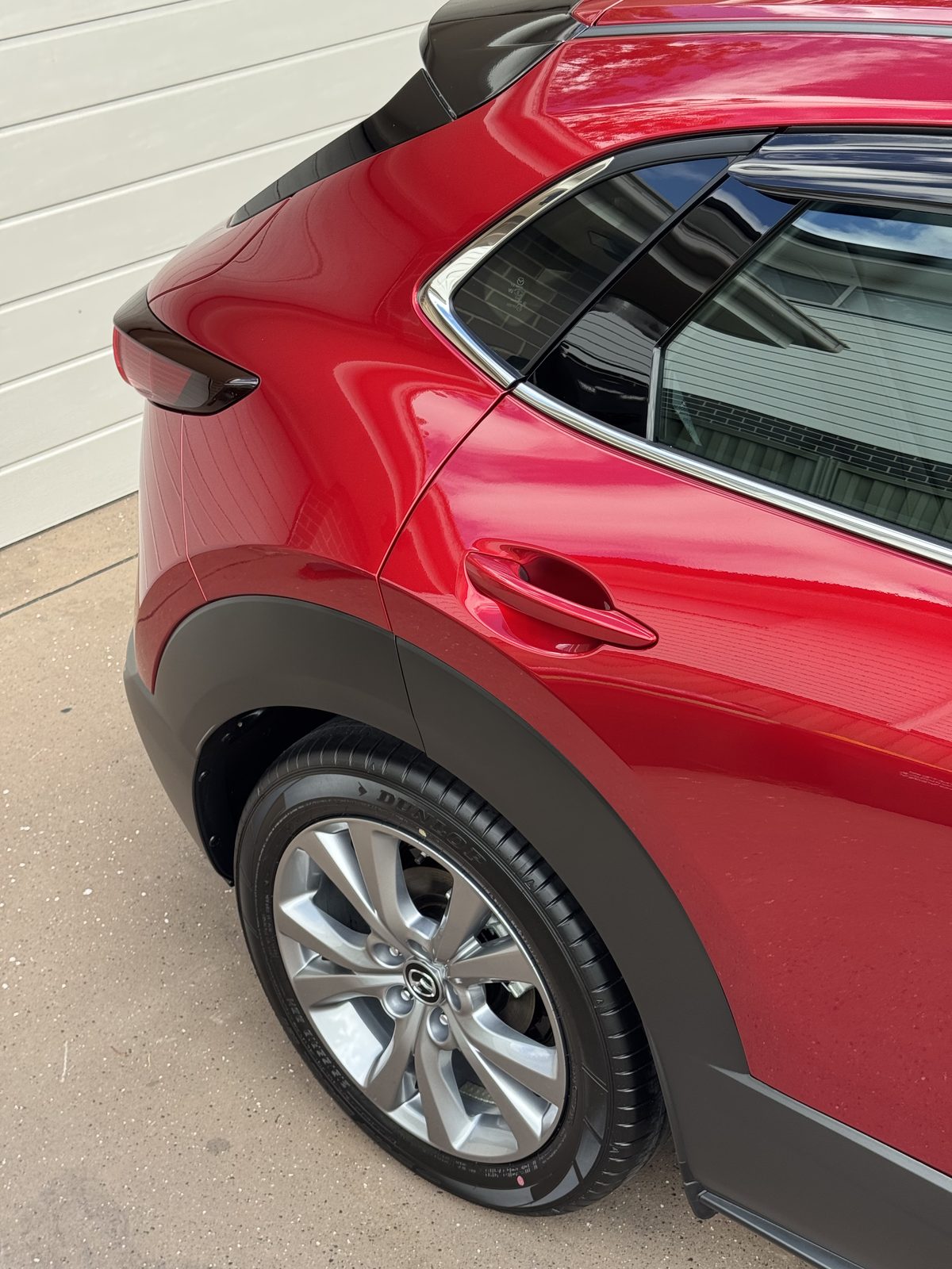 Ceramic coating gloss on a red Mazda